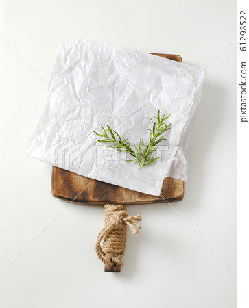 White butcher paper on cutting board 61298522