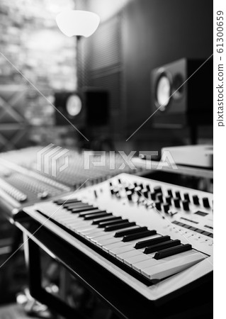 keyboard synthesizer in recording studio. black and white 61300659