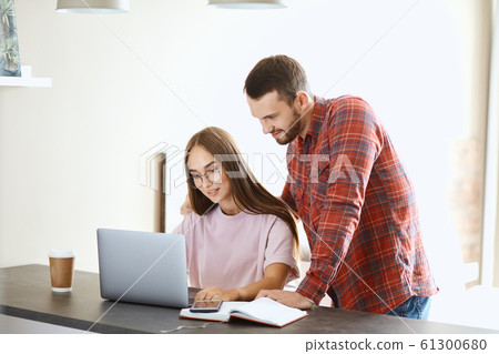 Young couple spends time near computer screen Young couple spends time near computer screen 61300680