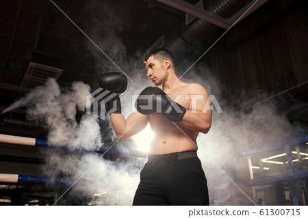angry boxer man in fight 61300715