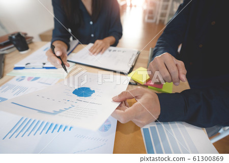 Business People Meeting to analyse and discuss and Business People Meeting to analyse and discuss and 61300869