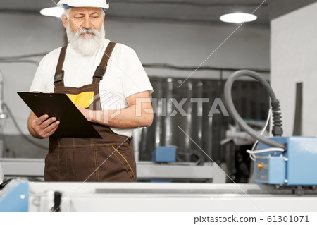 Professional engineer working with plasma cutter 61301071