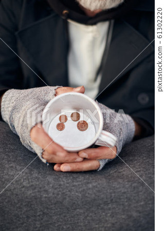 Top view on mug with some coins at bottom 61302220