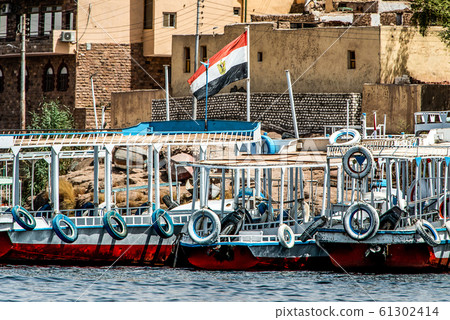 Marina Philae EGYPT Egyptian flag on Tourists boats to Philea temple UNESCO moved temple because of the Aswan Dam 61302414