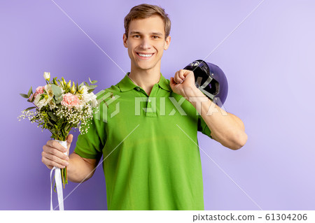 portrait of smiling pleasant man with flowers portrait of smiling pleasant man with flowers 61304206