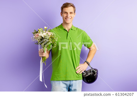 young caucasian man courier of flowers young caucasian man courier of flowers 61304207