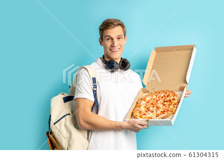 young caucasian pizza lover young caucasian pizza lover 61304315
