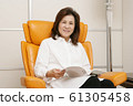 Lifestyle reading senior woman 61305458