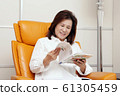 Lifestyle reading senior woman 61305459