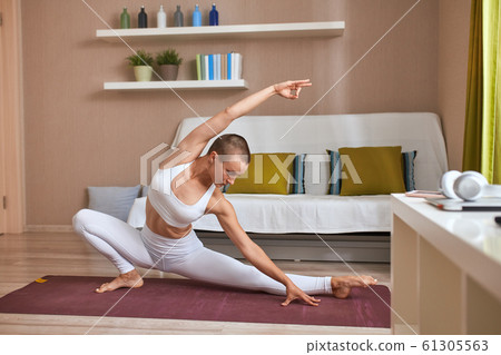 Sporty caucasian woman exercise on mat Sporty caucasian woman exercise on mat 61305563