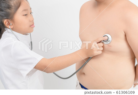Little  doctor check heart by stethoscope to obese 61306109