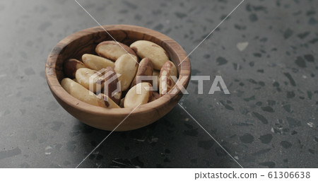 brazil nuts in olive bowl on terrazzo countertop brazil nuts in olive bowl on terrazzo countertop 61306638