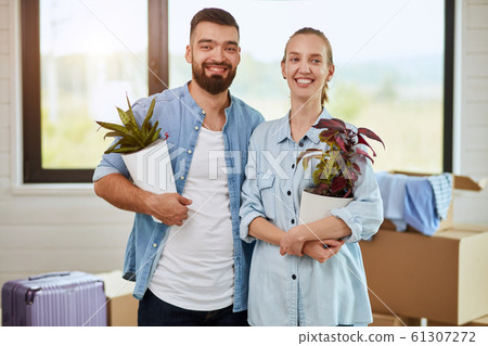 Caucasian family move in new big house Caucasian family move in new big house 61307272