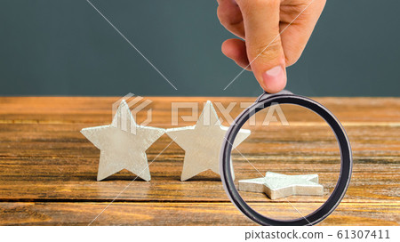 The fall of the third star. The concept of falling rating hotel or restaurant. Deterioration in service quality. Evaluation of the critic. Feedback. Bad business. Three stars The fall of the third star. The concept of falling rating hotel or restaurant. Deterioration in service quality. Evaluation of the critic. Feedback. Bad business. Three stars 61307411