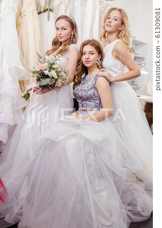 good-looking three women together in wedding dresses good-looking three women together in wedding dresses 61309081