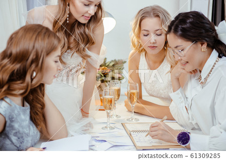 beautiful ladies sit having leisure time with designer beautiful ladies sit having leisure time with designer 61309285