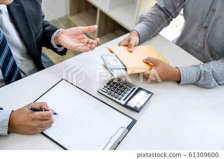 Bribery and corruption concept, bribe in the form Bribery and corruption concept, bribe in the form 61309600