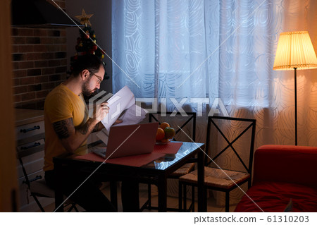 man work at home with laptop man work at home with laptop 61310203