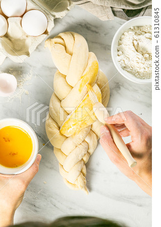 Making traditional jewish challah bread on marble background 61310845