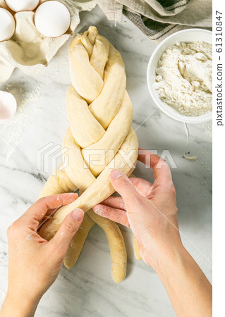 Making traditional jewish challah bread on marble background Making traditional jewish challah bread on marble background 61310847