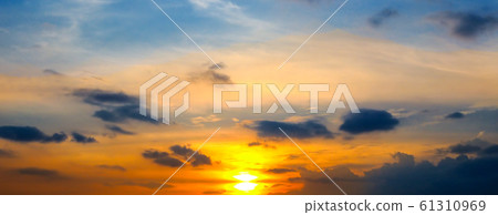 Cloudy sky and bright sunrise over the horizon. Cloudy sky and bright sunrise over the horizon. 61310969