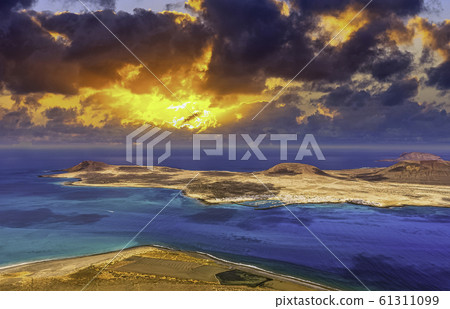 Sunrise over volcanic Island La Graciosa of the Atlantic Ocean 61311099