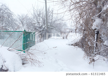 Winter, rural streets are covered with snow. Snow Winter, rural streets are covered with snow. Snow 61311465