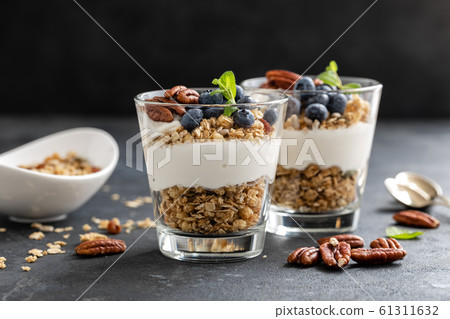 Blueberry parfait with ricotta cheese, granola and Blueberry parfait with ricotta cheese, granola and 61311632