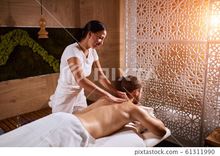 handsome man relaxing on massage table 61311990