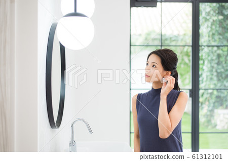 A woman getting dressed. A woman getting dressed. 61312101