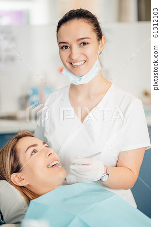 portrait of female dentist in office portrait of female dentist in office 61312103