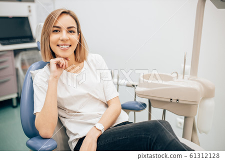 portrait of attractive woman in dentist office 61312128