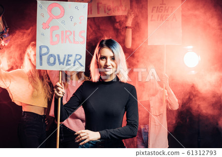 portrait of young feminist girl holding poster portrait of young feminist girl holding poster 61312793