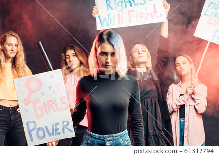 young caucasian women activist holding posters young caucasian women activist holding posters 61312794