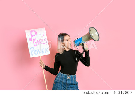 young caucasian woman with megaphone young caucasian woman with megaphone 61312809