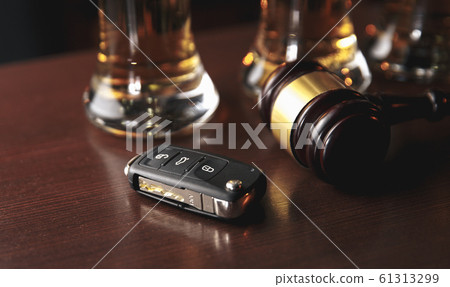 Drinking and driving concept. Car key on a wooden table, pub Drinking and driving concept. Car key on a wooden table, pub 61313299