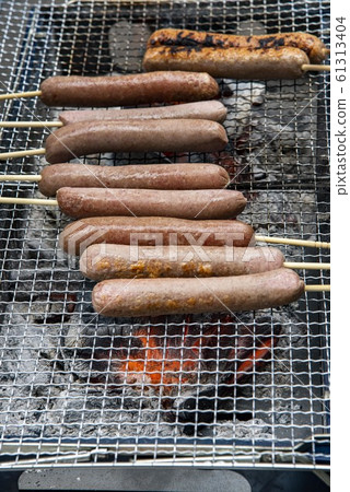 Sausage bake over charcoal Sausage bake over charcoal 61313404