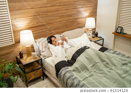 Young man sleeping bedroom lifestyle image 61314128