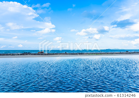 Beautiful outdoor swimming pool in hotel resort with white cloud and blue sky for leisure relax Beautiful outdoor swimming pool in hotel resort with white cloud and blue sky for leisure relax 61314246