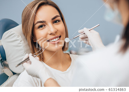 portrait of young caucasian woman with perfect smile portrait of young caucasian woman with perfect smile 61314863