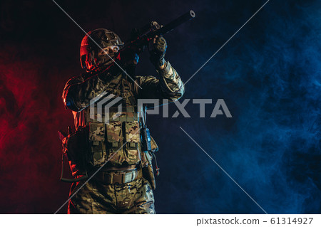 soldierly military man in smoky UV background 61314927