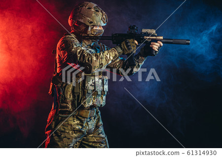 military service concept. young soldier isolated in smoke military service concept. young soldier isolated in smoke 61314930