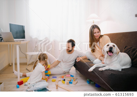 children, parents and pet at home children, parents and pet at home 61315693