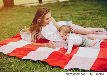 Mom and son relax in the park. Mom and son relax in the park. 61316981