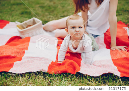 Mom and son relax in the park. 61317175