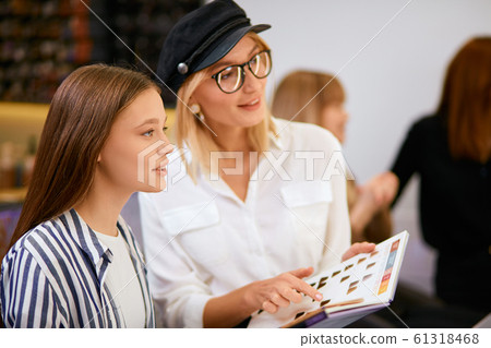 stylish modern hairdresser with colour palette stylish modern hairdresser with colour palette 61318468