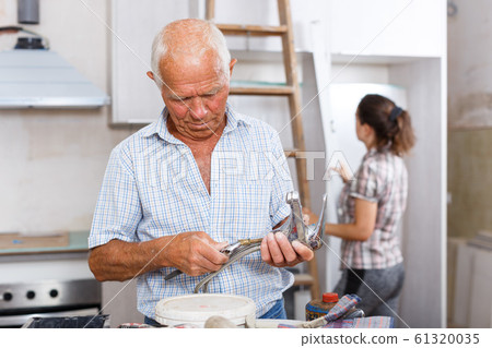 Man with mixer tap Man with mixer tap 61320035
