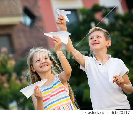 kids playing airplane toys 61320117