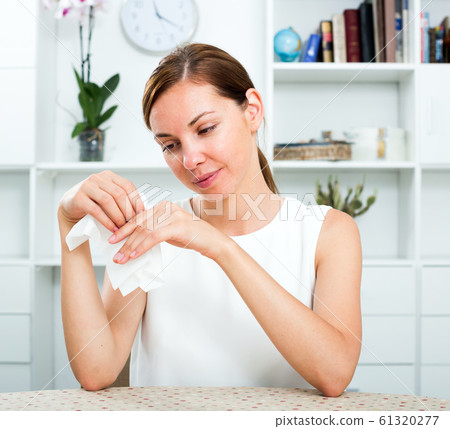 sad woman sitting 61320277