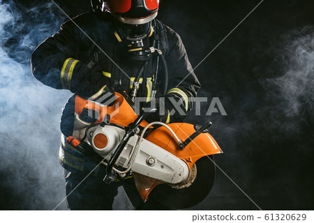 brave serious and confident extinguisher with equipment brave serious and confident extinguisher with equipment 61320629